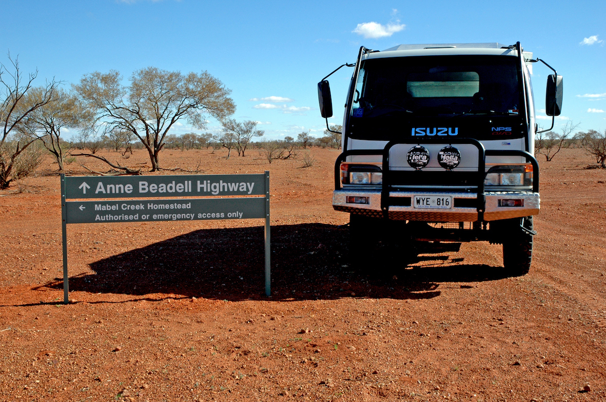 Truck and road sign