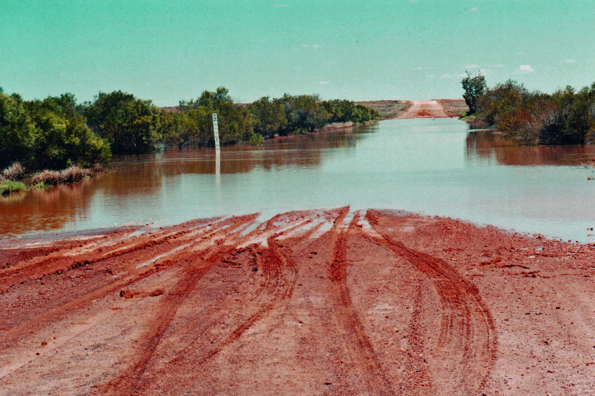 Swollen creek over track